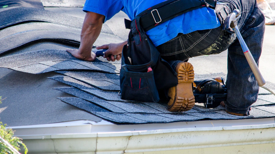 roofer during a shingle roof installation humble tx